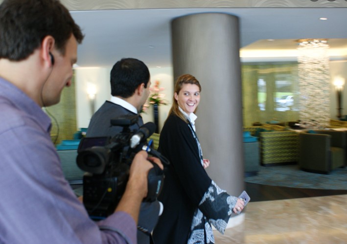 Diane Daudin-Clavaud walking with Arte TV journalists and a concierge at Rosewood in Saudi Arabia in 2013, where she was the Head of Communications.