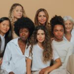 A group of diverse women of different ages and ethnicities, representing empowerment, inclusion, and diversity, featured in a She.Work article about DEI in 2025.