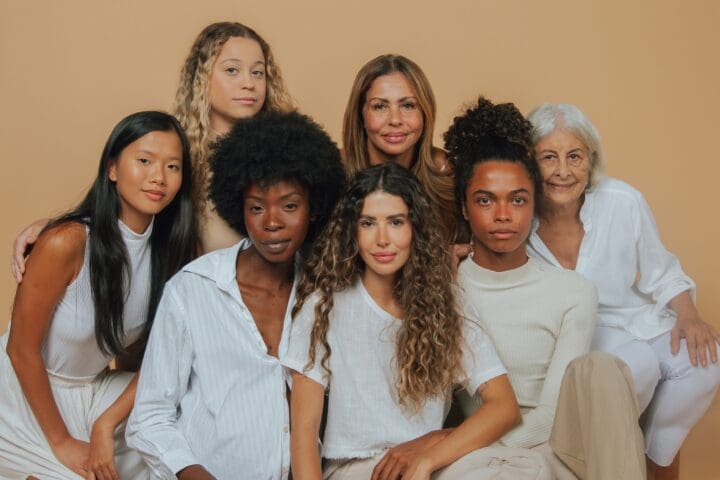 A group of diverse women of different ages and ethnicities, representing empowerment, inclusion, and diversity, featured in a She.Work article about DEI in 2025.